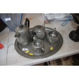 A spot hammered pewter tea set