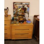 A 1960's light wood dressing table, having mirrore