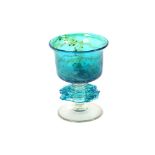 A large Mdina glass goblet, dated 1983; a pair of smaller goblets; a similar circular shallow bowl;