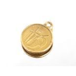 A five peseta gold coin, converted to a pendant; a