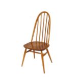 A set of four blonde Ercol stick back kitchen chairs