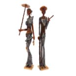 A pair of Cuban carved wooden figures, one depicti