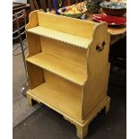 A Georgian design painted donkey bookcase, flanked by brass side carrying handles, raised on bracket