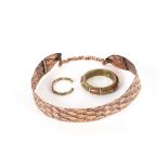 A Renoir copper belt; and two copper and brass ban