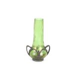 An Art Nouveau iridescent green glass spill vase,
