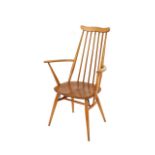 A set of four light Ercol stick back kitchen chairs, (two standards and two elbows)