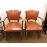 A pair of Art Deco elbow chairs, with leather upho