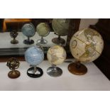 Three vintage world globes, and a miniature brass