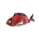 An unusual continental pottery fish tureen, red gl