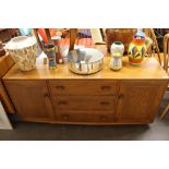 An Ercol sideboard, fitted three central drawers flanked by cupboards, 155cm wide