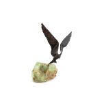 A bronze figure of a bird in flight, on hardstone base, by Grace Critchley, 35cm high