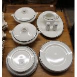 A quantity of white and black bordered dinnerware to include, tureens, meat plates, dinner plates,