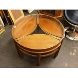 A Nathan teak circular nest of four tables