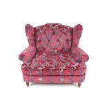 A modern wing back snuggle chair, having red and g