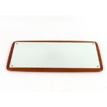 A Danish teak framed wall mirror, stamped Made In Denmark, 44c