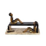 An Art Deco cold painted bronze and marble figure group, depicting girl tennis players relaxing,