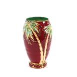 A Beswick baluster vase, decorated palm trees on a