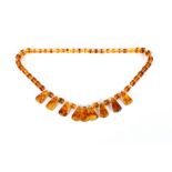 A string of vintage amber coloured beads