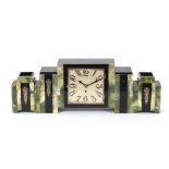 An Art Deco black and green marble clock set