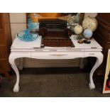 A white painted dressing table, fitted single frie