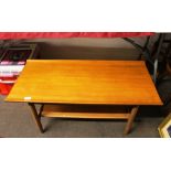 A teak G plan design two tier coffee table, raised on rounded tapering supports, 91cm