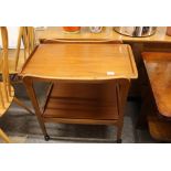 A 1960's teak two tier tea trolley, 70cm wide in extremes