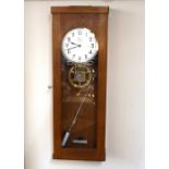 A light oak cased Master clock