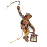 A Black Forest style figural hanging lamp