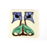 An Art Deco design tile, 15.3cm square