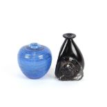 A black Art Glass baluster vase, having applied ch