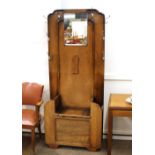 An oak Art Deco design hall stand / seat, having m