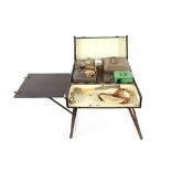 A leather covered folding picnic set