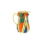 A Clarice Cliff Bizarre baluster jug, brightly coloured stylised decoration, 16cm high