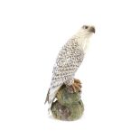 A Royal Copenhagen study of an eagle, perched on a rock, stamped and signed to base, 41cm high