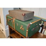 A large wooden bound suitcase together with a laun