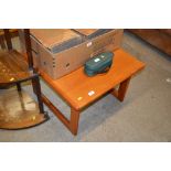 A teak square top coffee table