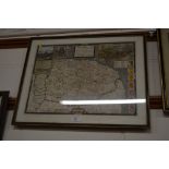 A framed and glazed coloured map of Norfolk 1549