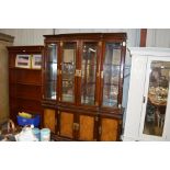 A large Chinese glazed cabinet raised on cupboard