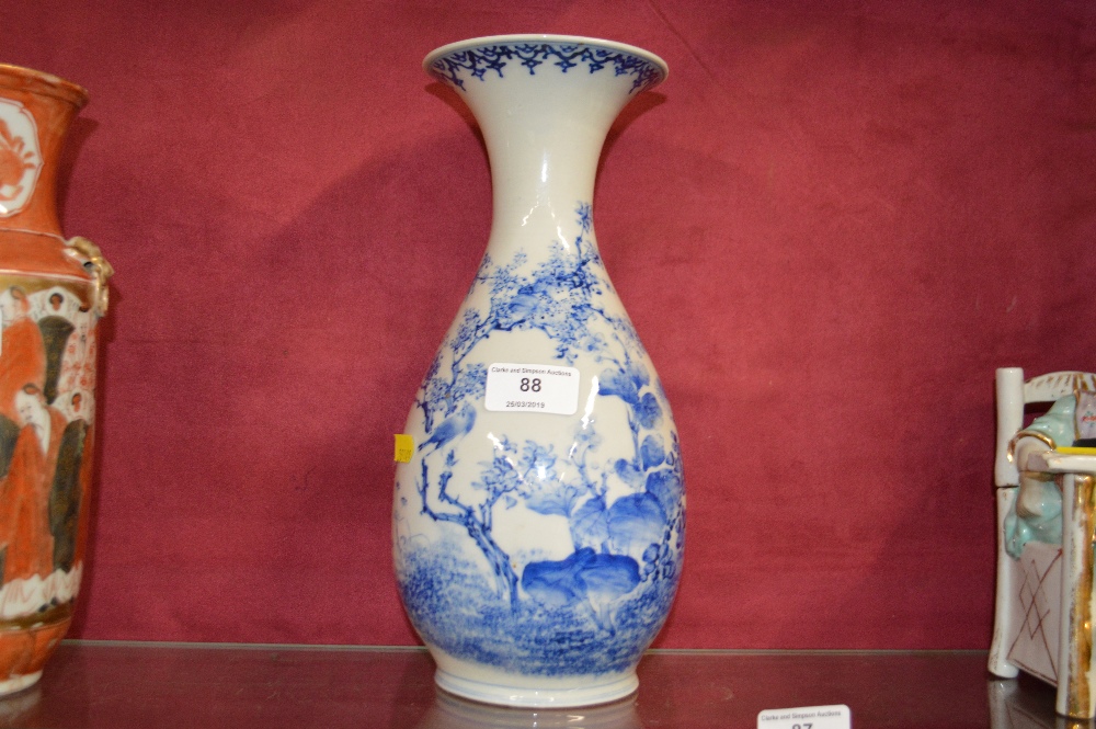 An oriental blue and white baluster vase with flor