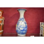 An oriental blue and white baluster vase with flor