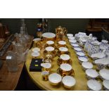 A quantity of gold painted teaware; an over laid g