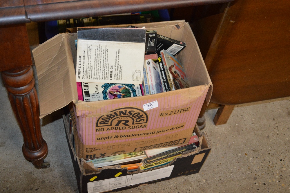 Three boxes of paperback books