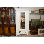 A late Victorian white painted single door wardrob