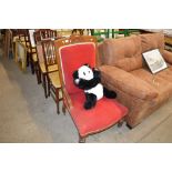 A late Victorian oak and red upholstered nursing c