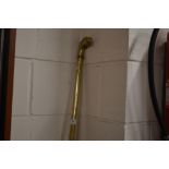 A hollow brass walking stick with detachable eagle