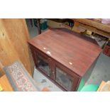 A reproduction mahogany TV stand