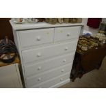 A white painted chest fitted two short over four l