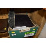 A box containing a photo album, post-card album an