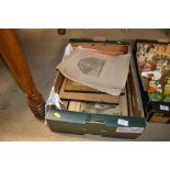 A box of various pictures and prints
