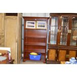 A reproduction mahogany open fronted bookcase